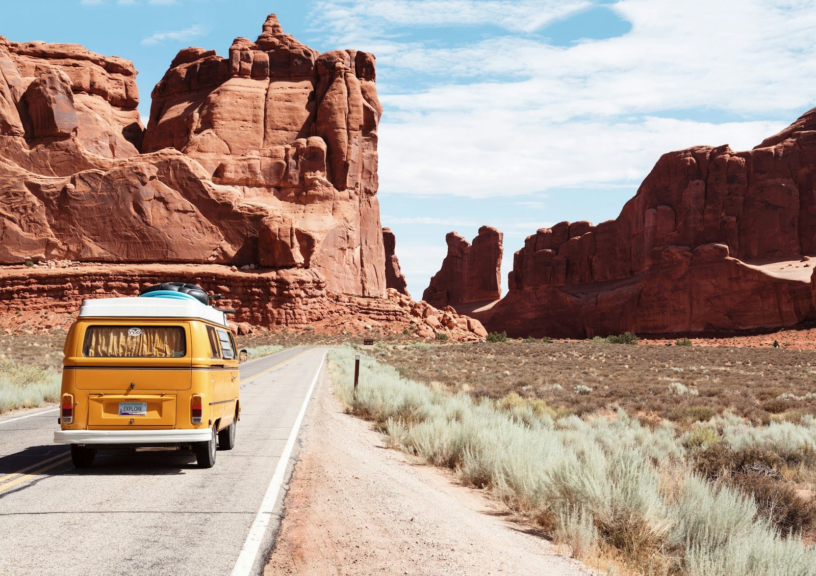 Amex Travel road trip through desert landscapes with a vintage yellow van